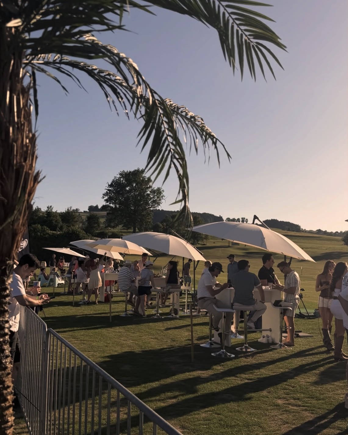 Crowd dancing outdoors on a golf course